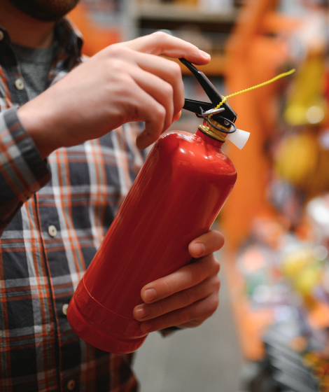 a customer at looking at fire extinguisher